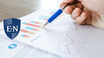 A person reviewing documents for financial planning for small business owners. 